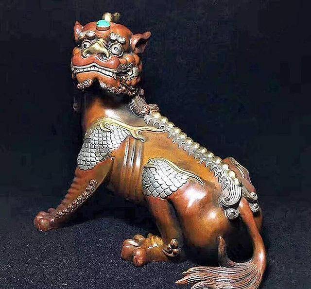 聚众物之优容为一体",谛听有虎头,犬耳,独角,龙身,麒麟足,狮尾